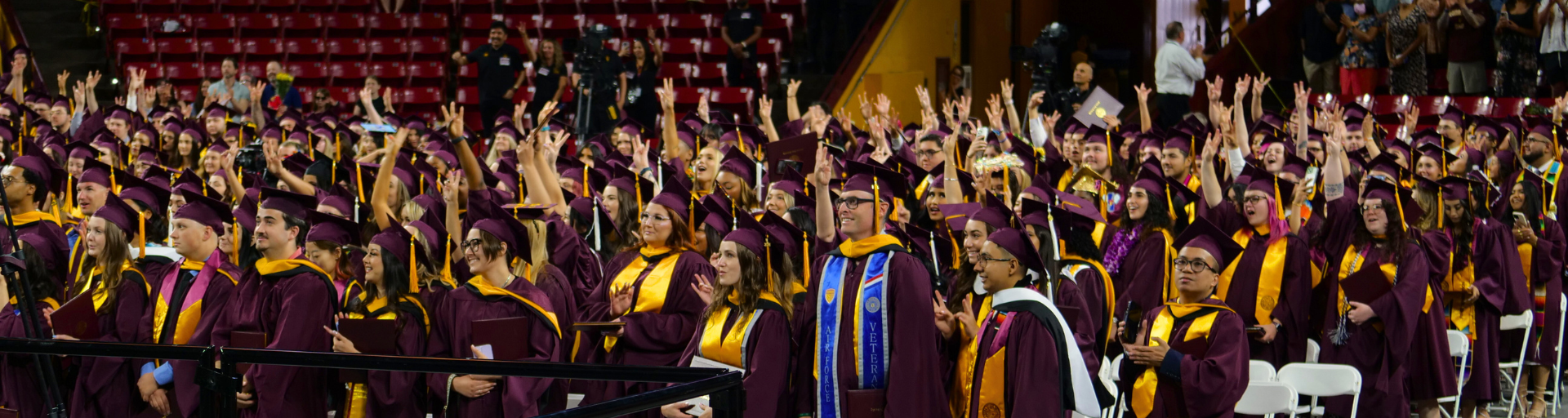 A crowd of New College students in regalia at convocation